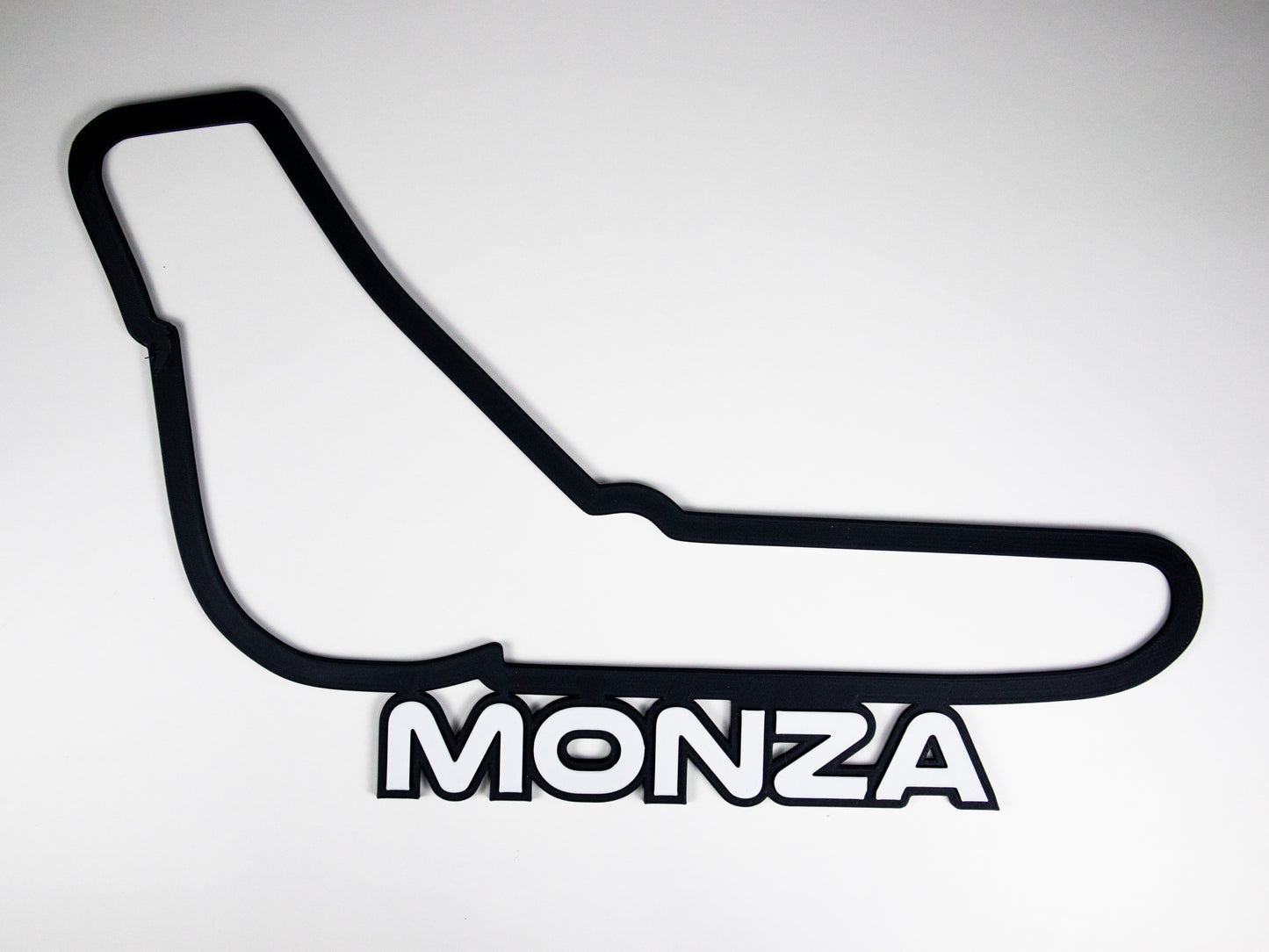 Silueta minimalista del circuito de Monza de Formula 1 sobre fondo blanco para pared