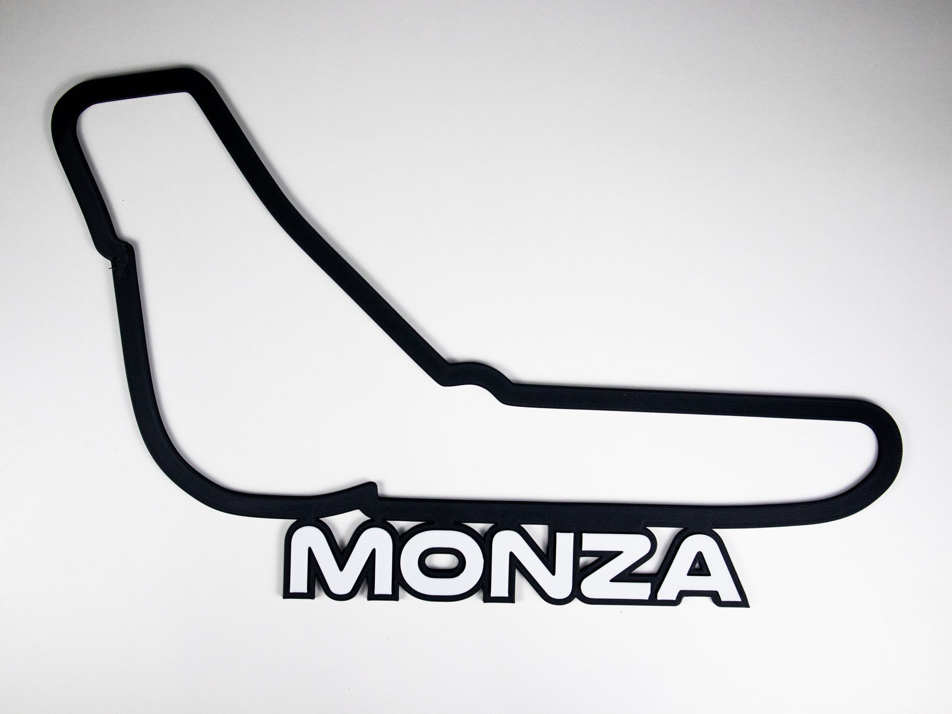 Silueta minimalista del circuito de Monza de Formula 1 sobre fondo blanco para pared